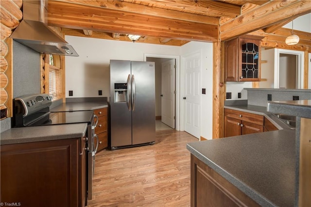 1310 Lynchburg Rd, Westfield, NC 27053 - kitchen featuring beam ceiling, wall chimney range hood, dark countertops, appliances with stainless steel finishes, and light wood finished floors
