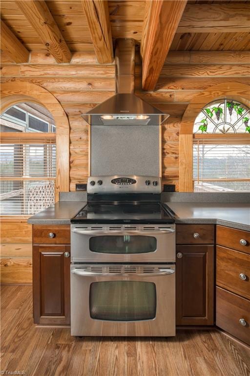 1310 Lynchburg Rd, Westfield, NC 27053 - kitchen with a wealth of natural light, double oven range, ventilation hood, wooden ceiling, and log walls