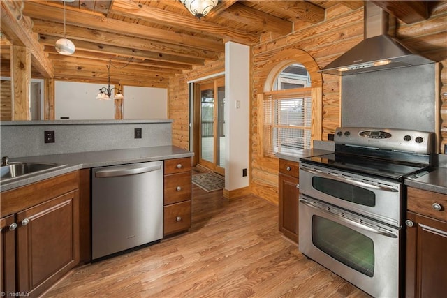 1310 Lynchburg Rd, Westfield, NC 27053 - kitchen with wall chimney range hood, beamed ceiling, wood ceiling, light wood-type flooring, and stainless steel appliances