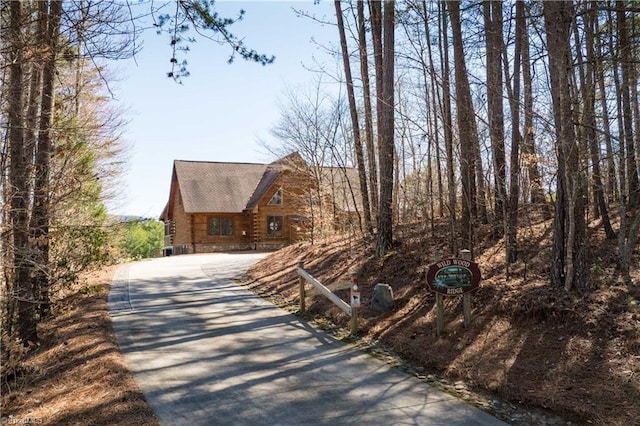 1310 Lynchburg Rd, Westfield, NC 27053 - exterior space with log siding, roof with shingles, and driveway