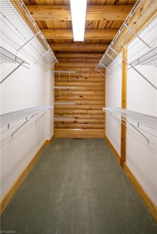 1310 Lynchburg Rd, Westfield, NC 27053 - spacious closet featuring beam ceiling and carpet floors
