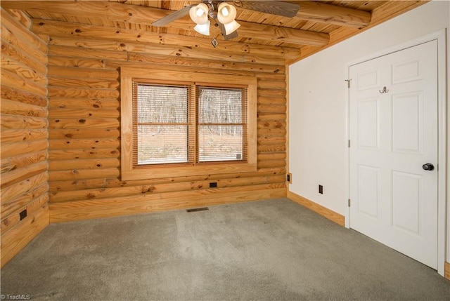 1310 Lynchburg Rd, Westfield, NC 27053 - carpeted spare room featuring visible vents, baseboards, beam ceiling, wooden ceiling, and a ceiling fan