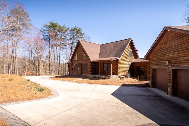1310 Lynchburg Rd, Westfield, NC 27053 - log cabin with log exterior, a shingled roof, and driveway