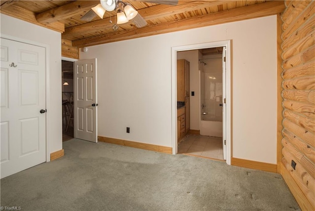 1310 Lynchburg Rd, Westfield, NC 27053 - unfurnished bedroom featuring beamed ceiling, light colored carpet, wood ceiling, and baseboards