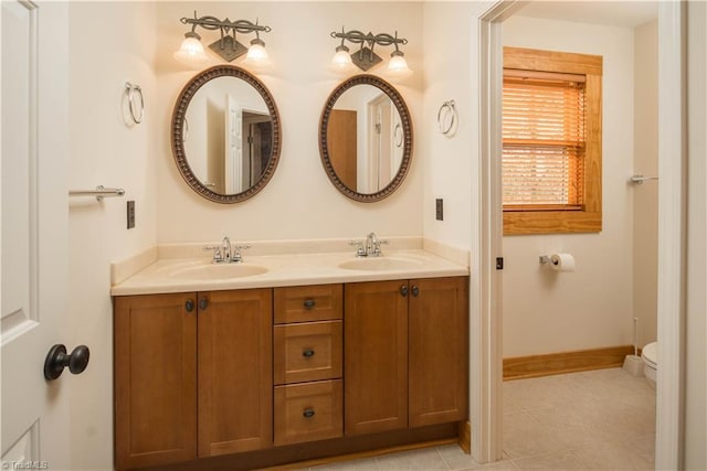 1310 Lynchburg Rd, Westfield, NC 27053 - full bath featuring double vanity, toilet, baseboards, and a sink