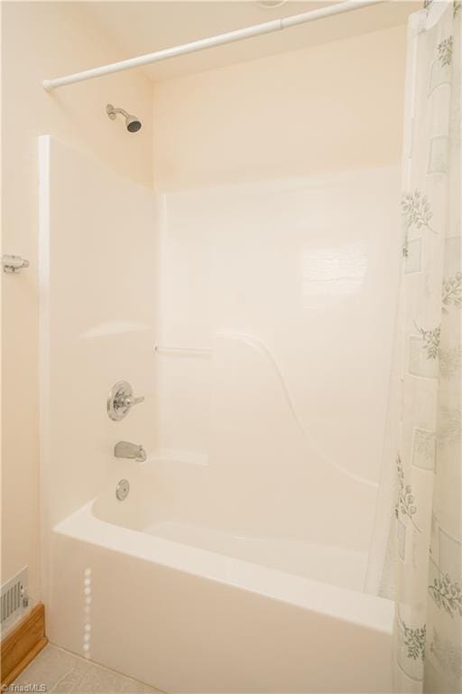 1310 Lynchburg Rd, Westfield, NC 27053 - bathroom featuring tile patterned floors and shower / bath combo