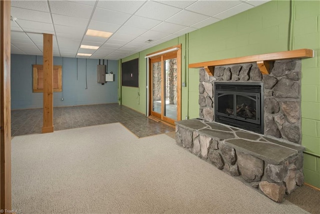 1310 Lynchburg Rd, Westfield, NC 27053 - living room with a drop ceiling, carpet floors, a stone fireplace, and concrete block wall