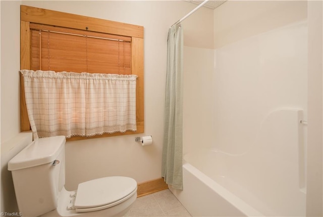 1310 Lynchburg Rd, Westfield, NC 27053 - bathroom featuring tile patterned floors, baseboards, toilet, and shower / bath combo with shower curtain