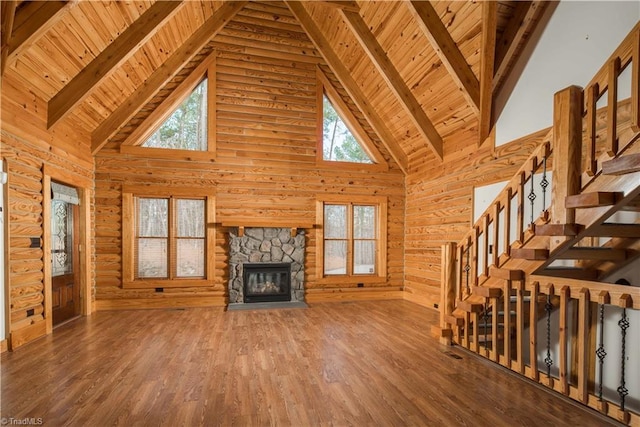 1310 Lynchburg Rd, Westfield, NC 27053 - unfurnished living room with beam ceiling, wood finished floors, a healthy amount of sunlight, and wooden ceiling