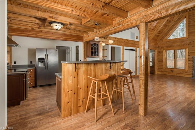 1310 Lynchburg Rd, Westfield, NC 27053 - kitchen with a kitchen breakfast bar, dark countertops, wooden ceiling, and stainless steel refrigerator with ice dispenser