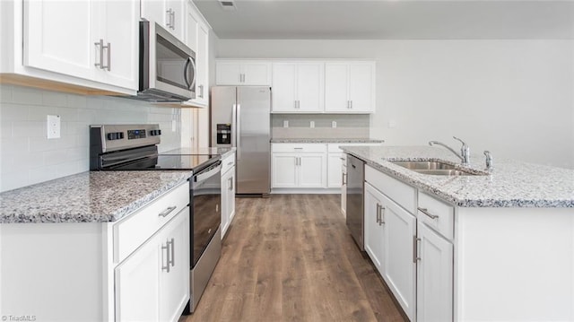 kitchen featuring a sink, appliances with stainless steel finishes, dark wood-style floors, and white cabinetry