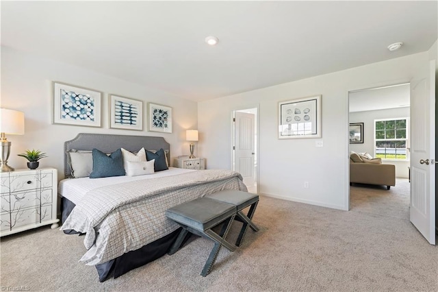 carpeted bedroom with baseboards