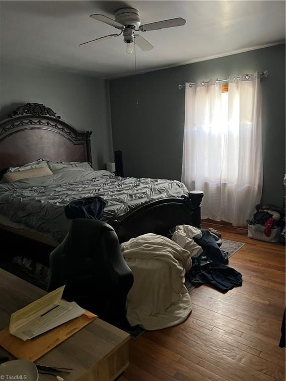 bedroom featuring a ceiling fan and hardwood / wood-style floors