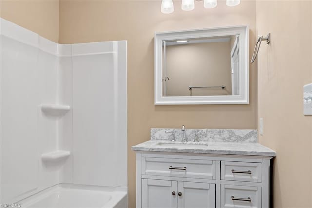 bathroom with vanity and washtub / shower combination