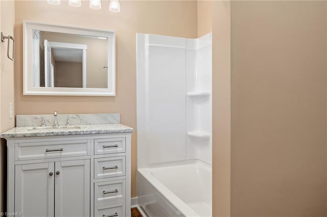 bathroom featuring vanity and shower / tub combination