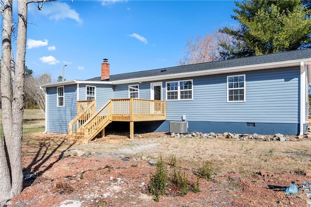 back of house featuring central air condition unit, a chimney, a wooden deck, crawl space, and stairs