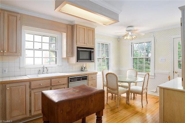 515 N Pine Valley Rd N, Winston-Salem, NC 27106 - kitchen featuring black microwave, white dishwasher, ornamental molding, light wood finished floors, and wallpapered walls