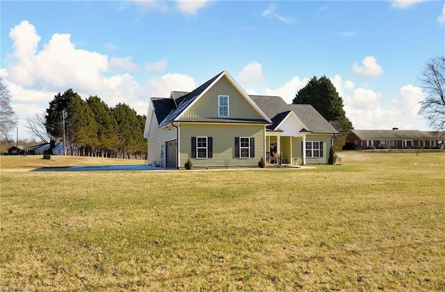 rear view of property featuring a yard