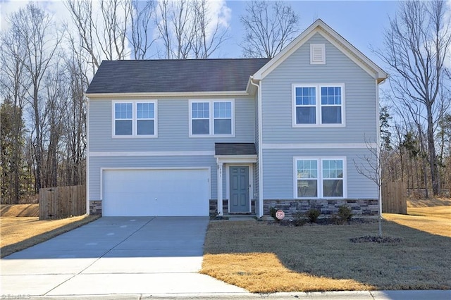 view of front facade with a garage and a front yard