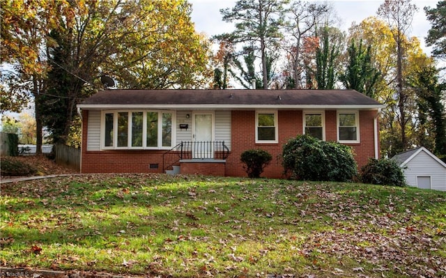 ranch-style home with a front lawn