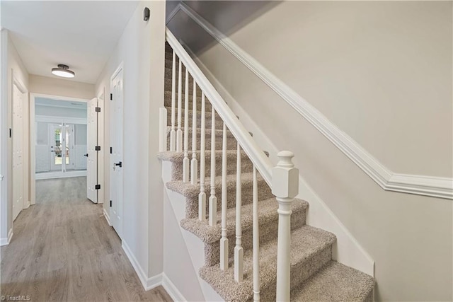 stairs featuring wood-type flooring