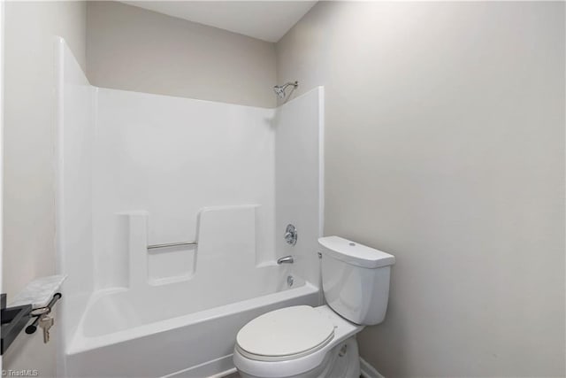 bathroom featuring bathing tub / shower combination and toilet