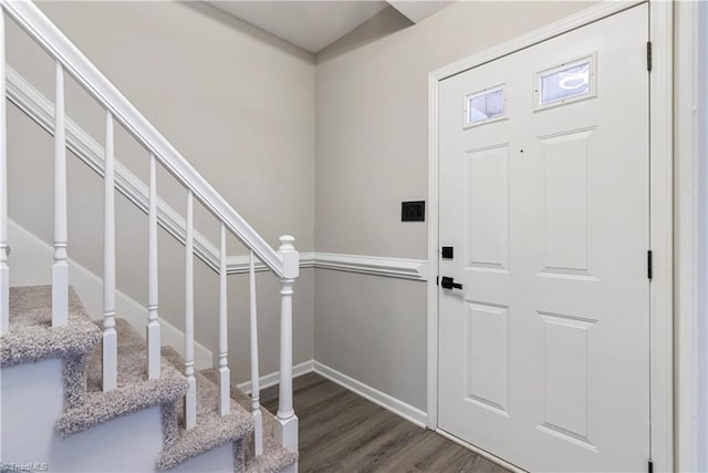 entryway with dark hardwood / wood-style floors