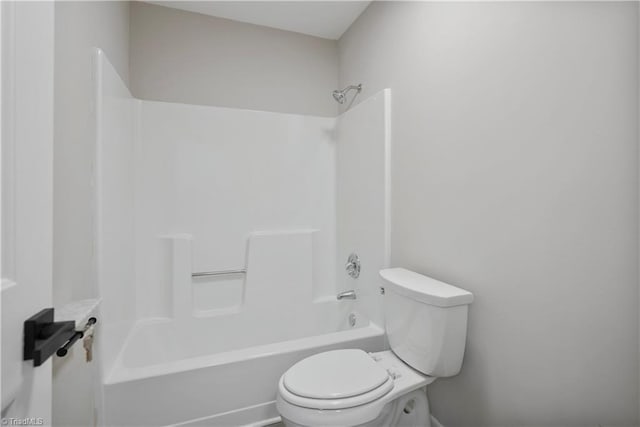 bathroom with toilet and shower / bath combination