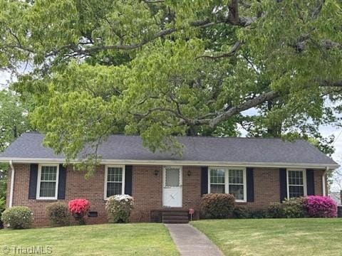 single story home with brick siding, a front lawn, and entry steps