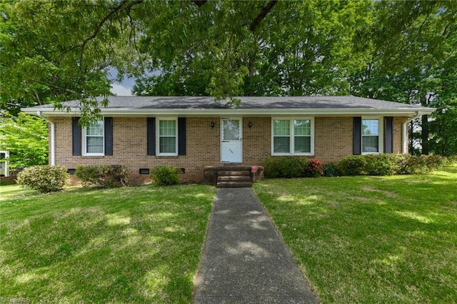 single story home featuring a front yard, brick siding, and crawl space
