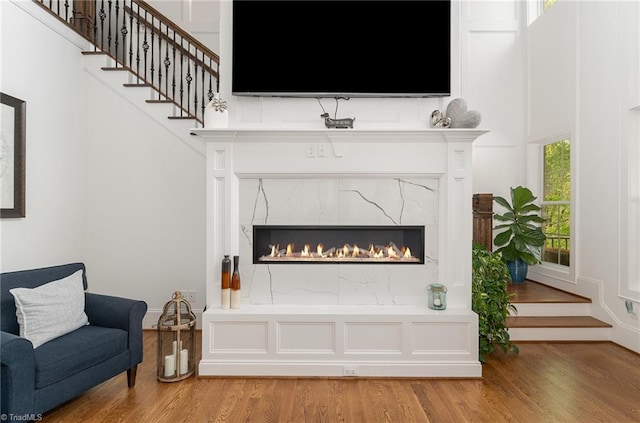6323 Nesting Way, Oak Ridge, NC 27310 - interior space featuring a fireplace, light wood-style flooring, and stairway