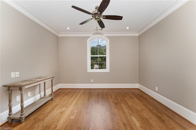 6323 Nesting Way, Oak Ridge, NC 27310 - spare room with ornamental molding, baseboards, a ceiling fan, and light wood-style floors