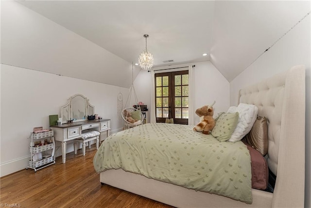 6323 Nesting Way, Oak Ridge, NC 27310 - bedroom featuring french doors, recessed lighting, a chandelier, lofted ceiling, and wood finished floors