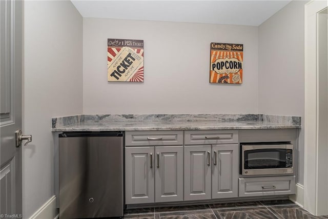 6323 Nesting Way, Oak Ridge, NC 27310 - interior space featuring stainless steel microwave and refrigerator