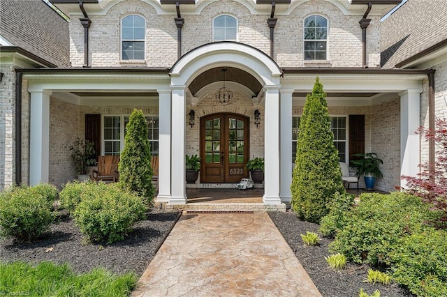 6323 Nesting Way, Oak Ridge, NC 27310 - property entrance with brick siding, covered porch, and french doors