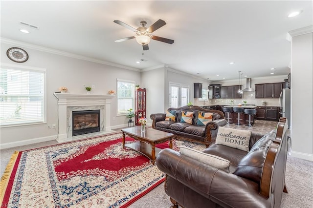2110 Owls View Ln, Colfax, NC 27235 - living room featuring a ceiling fan, crown molding, recessed lighting, and a premium fireplace