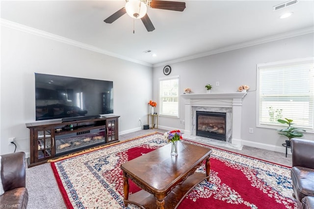 2110 Owls View Ln, Colfax, NC 27235 - living area with a premium fireplace, ornamental molding, a ceiling fan, and carpet floors