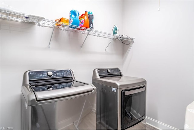 2110 Owls View Ln, Colfax, NC 27235 - laundry area with separate washer and dryer and baseboards
