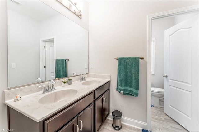 2110 Owls View Ln, Colfax, NC 27235 - bathroom with wood finished floors and double vanity