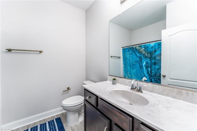 2110 Owls View Ln, Colfax, NC 27235 - full bath with vanity, wood finished floors, and a shower with curtain