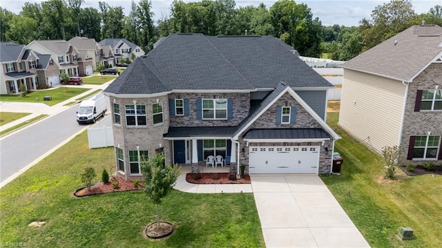 2110 Owls View Ln, Colfax, NC 27235 - view of front facade with driveway, stone siding, a garage, and a front lawn