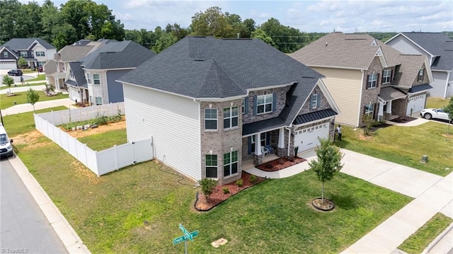2110 Owls View Ln, Colfax, NC 27235 - view of front of home featuring concrete driveway, a residential view, an attached garage, stone siding, and a shingled roof