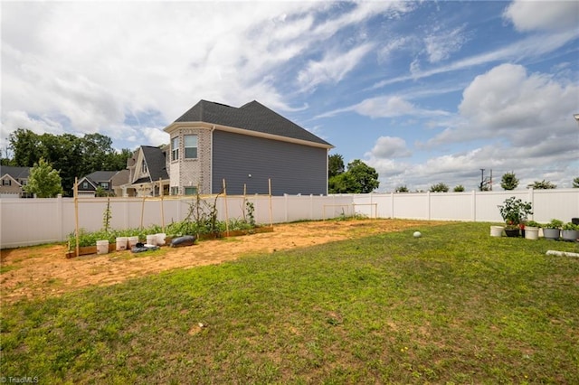 2110 Owls View Ln, Colfax, NC 27235 - fenced backyard featuring a vegetable garden