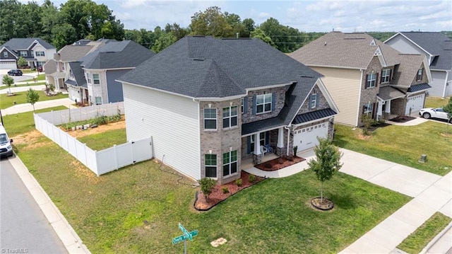 2110 Owls View Ln, Colfax, NC 27235 - view of front of home featuring concrete driveway, a residential view, an attached garage, stone siding, and roof with shingles