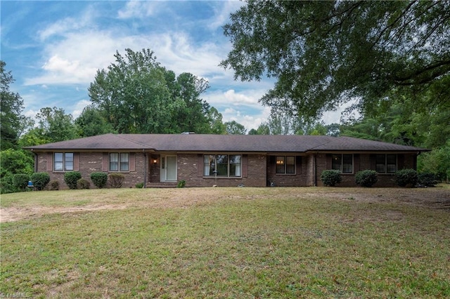 single story home featuring a front lawn