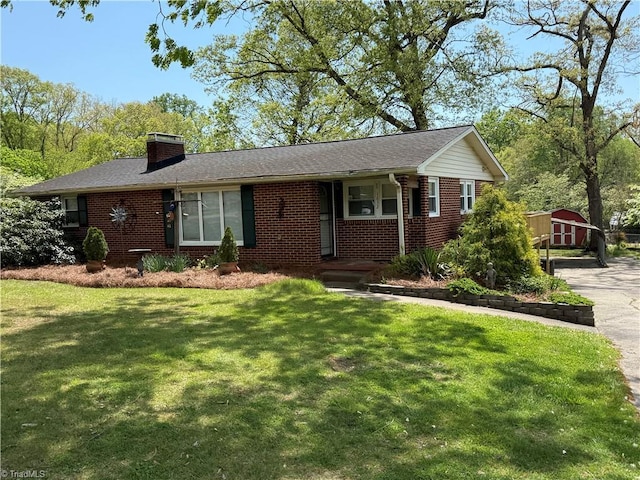 1632 Sanford Dr, Winston-Salem, NC 27105 - ranch-style house featuring brick siding, a front yard, covered porch, and a chimney