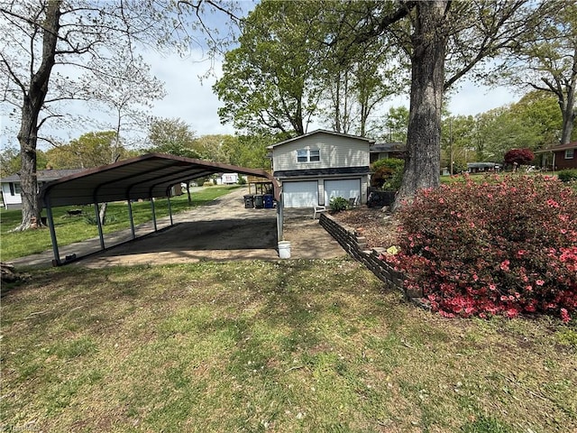 1632 Sanford Dr, Winston-Salem, NC 27105 - view of yard featuring a carport, an attached garage, and driveway
