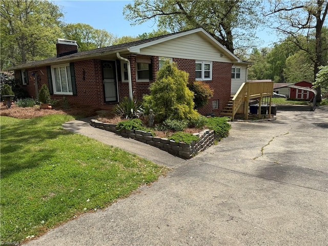 1632 Sanford Dr, Winston-Salem, NC 27105 - ranch-style home featuring a chimney, driveway, a front yard, and brick siding