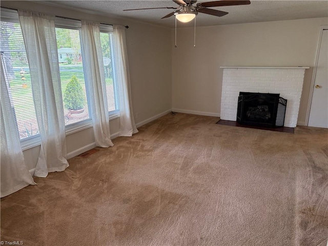 1632 Sanford Dr, Winston-Salem, NC 27105 - unfurnished living room featuring carpet, a ceiling fan, visible vents, a brick fireplace, and baseboards