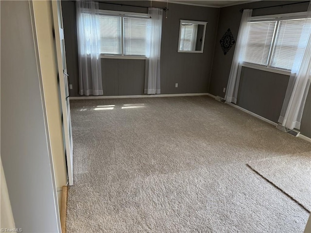 1632 Sanford Dr, Winston-Salem, NC 27105 - carpeted empty room featuring baseboards and plenty of natural light